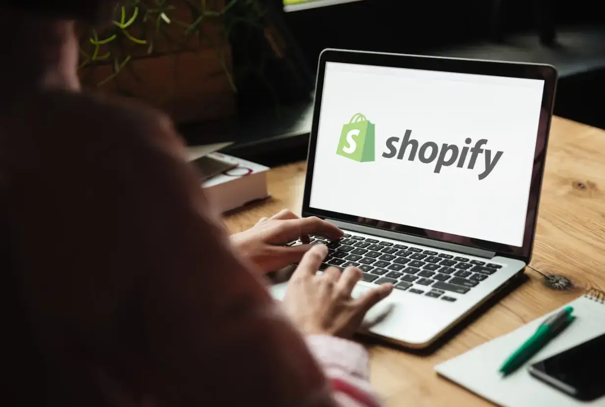 a shopify developer with a laptop